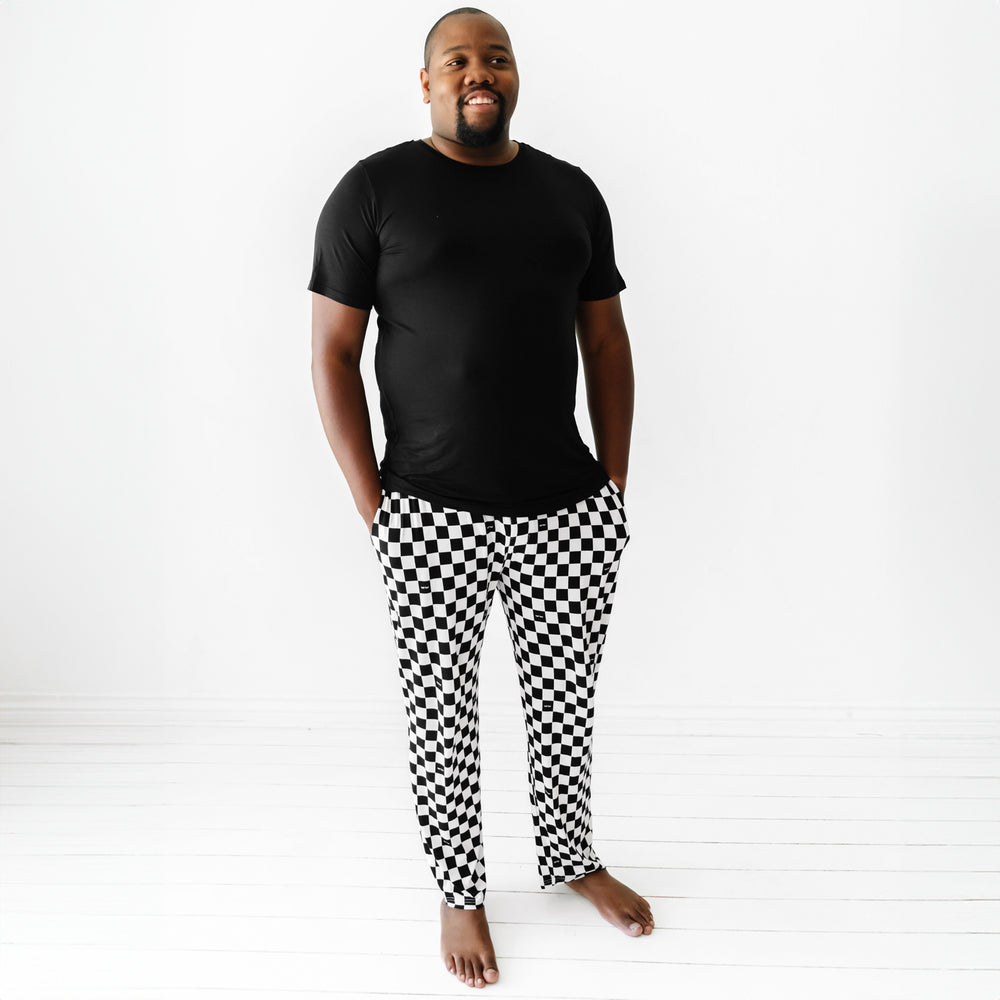 man wearing Cool Checks men's PJ pants and solid black men's pj top