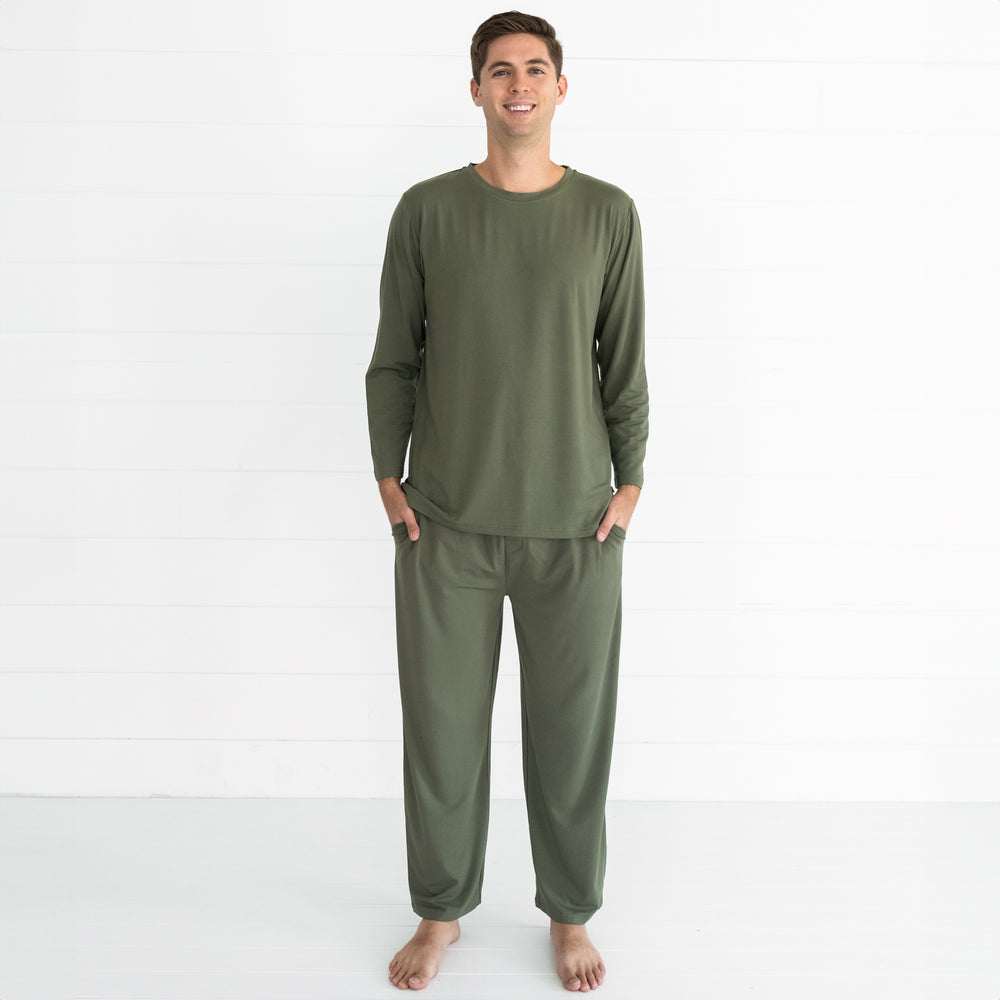 Man wearing men's Cozy Olive pj top and matching men's pj pants