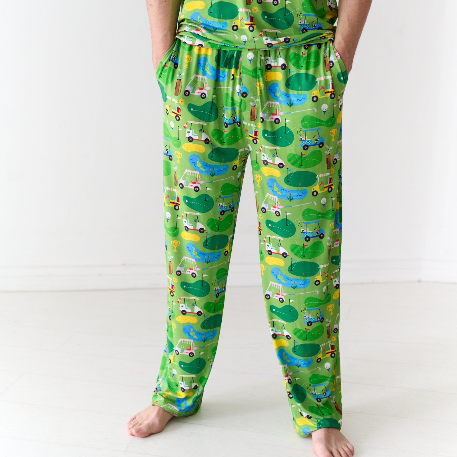 Close up image of a man wearing Fairway Fun Men's Pajama Pants and matching pajama top