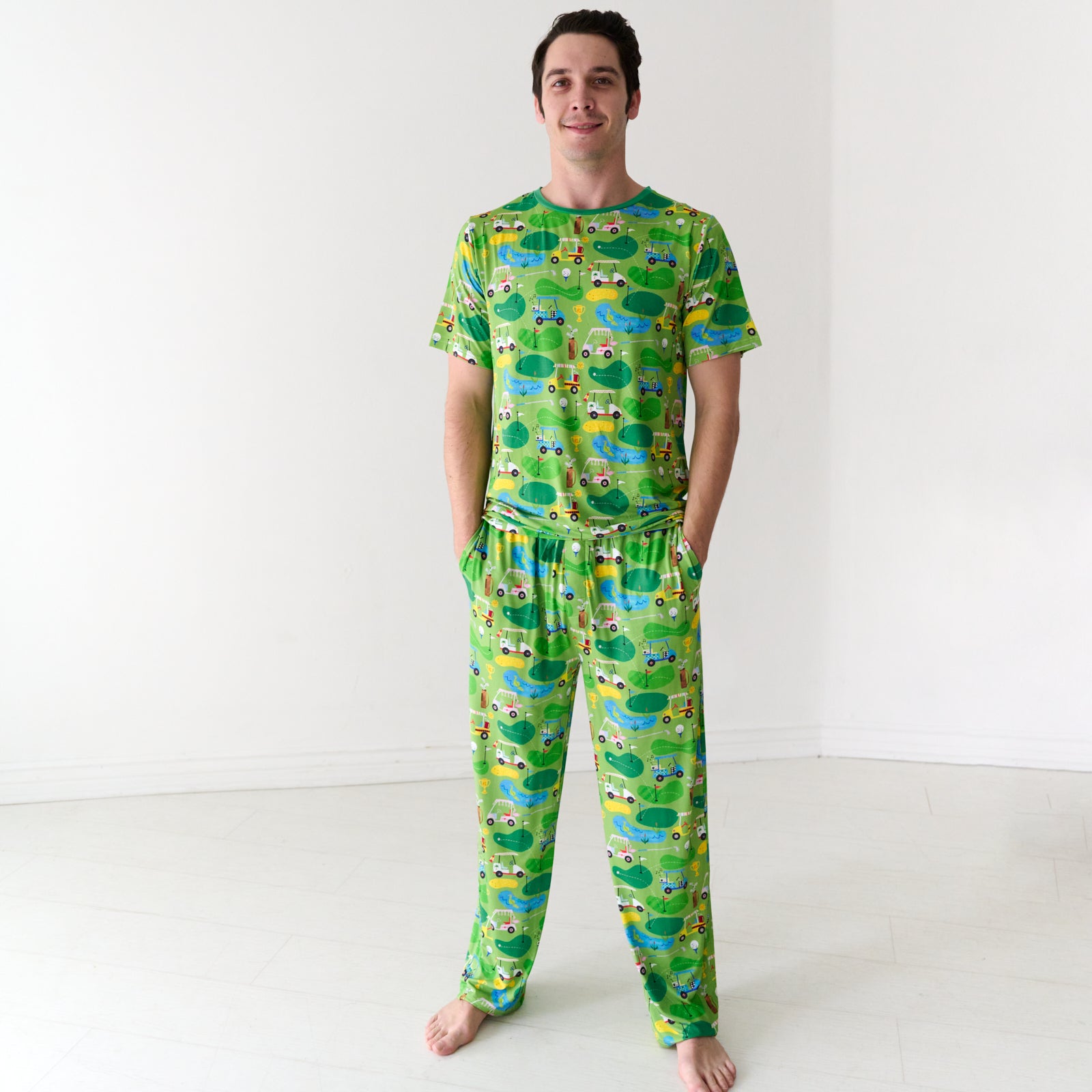 Man wearing a Fairway Fun men's short sleeve pajama top and matching pajama pants