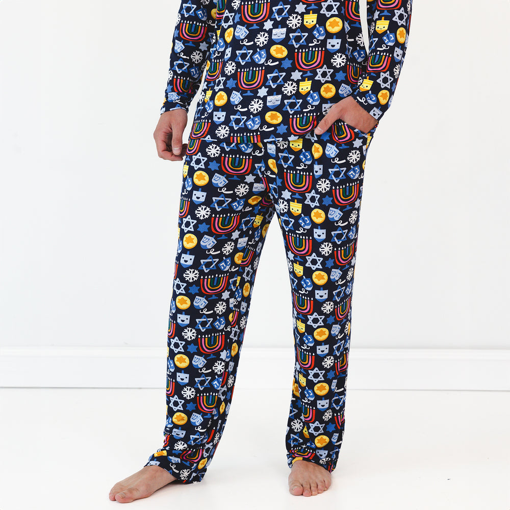 Close up image of a man wearing Playful Dreidels Men's Pajama Pants and Top