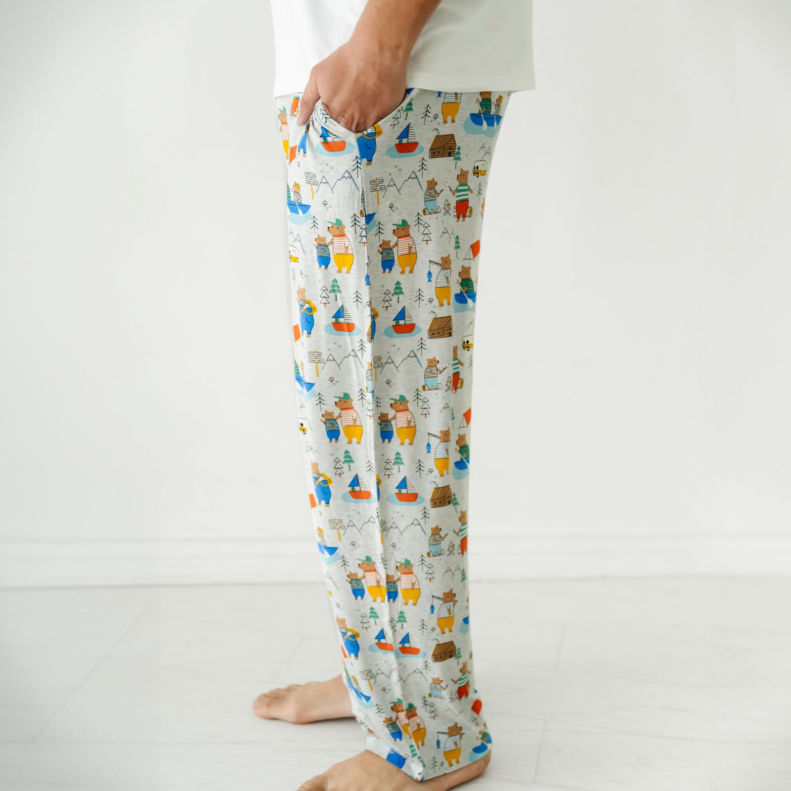 Close up profile image of a man wearing Papa Bear men's pajama pants