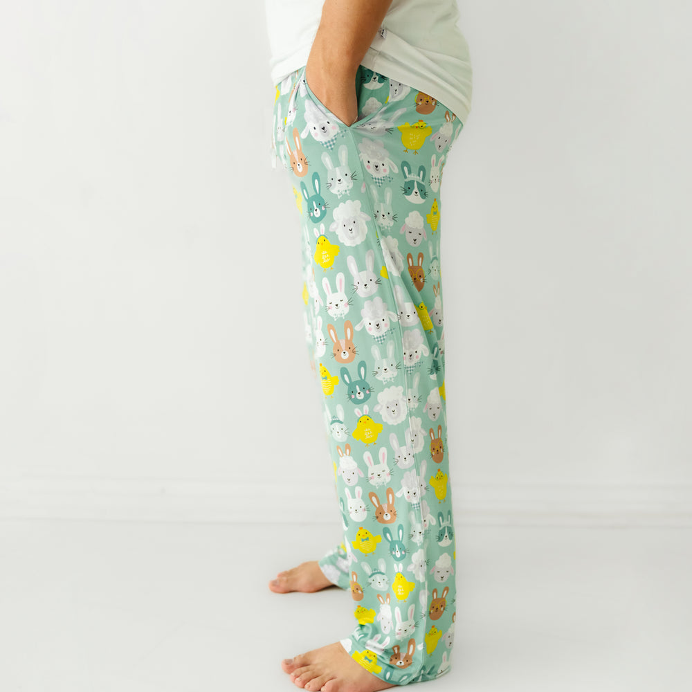 Close up profile image of a man wearing Aqua Pastel Parade men's pajama pants