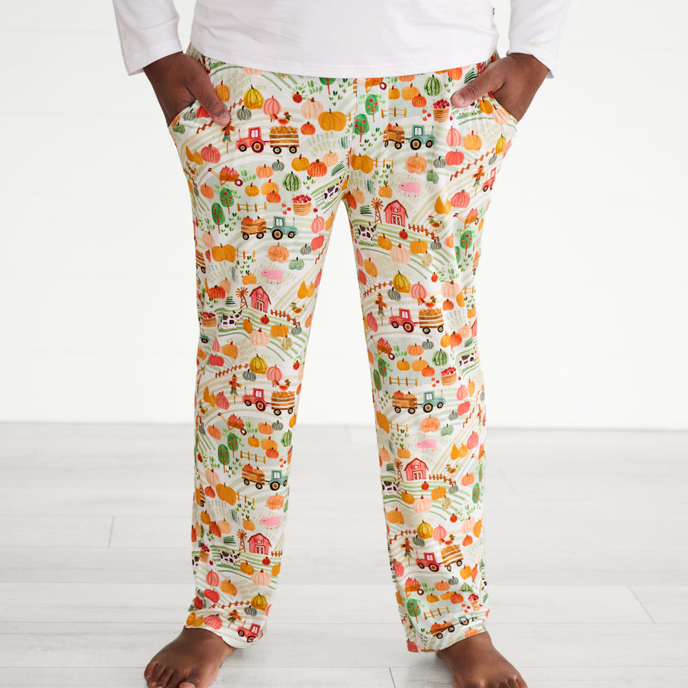 Close up image of a man wearing Happy Harvest men's pj pants