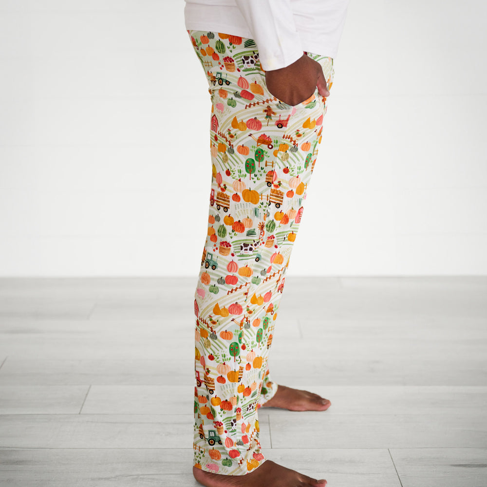 Profile close up image of a man wearing Happy Harvest men's pj pants