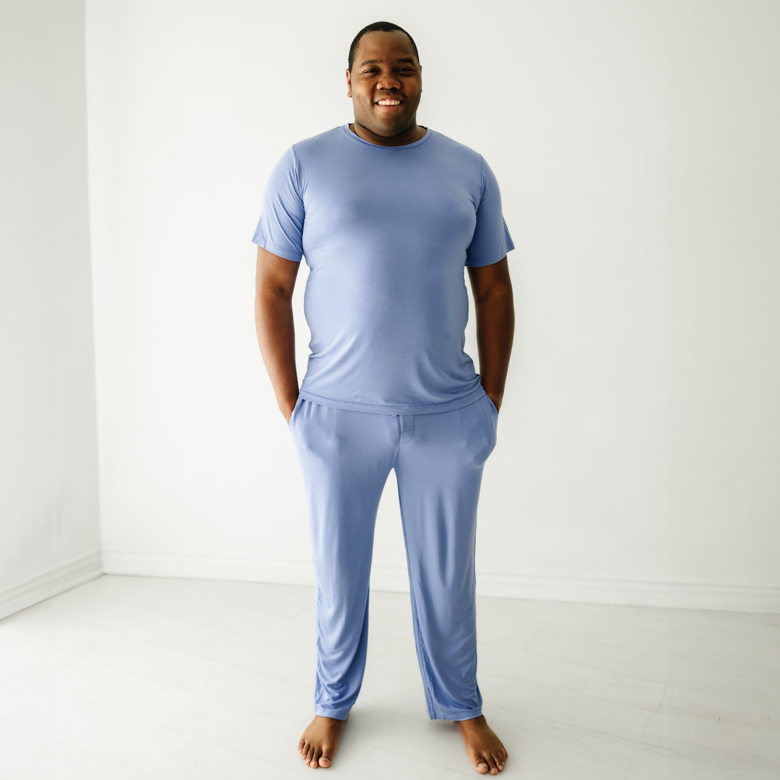 Image of a man wearing Slate Blue men's pajama top and matching men's pajama pants