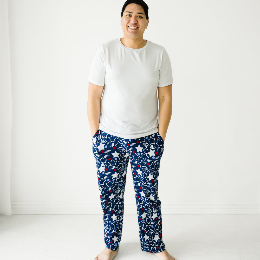 Man wearing a men's bright white pj top paired with Star Spangled men's pj pants