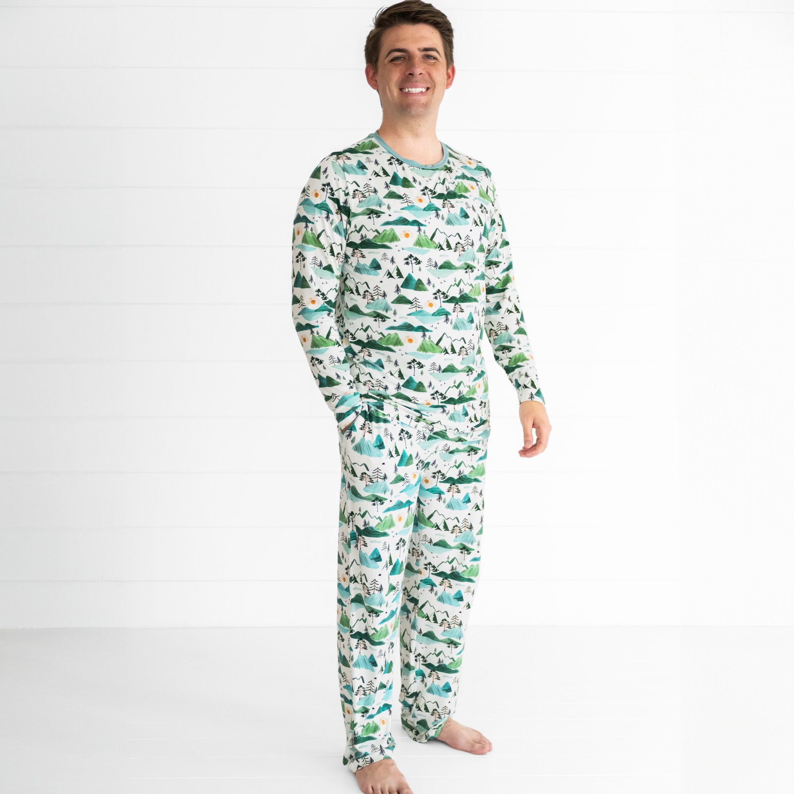 Man wearing Mountain Mist printed pjs in men's top and bottom styles