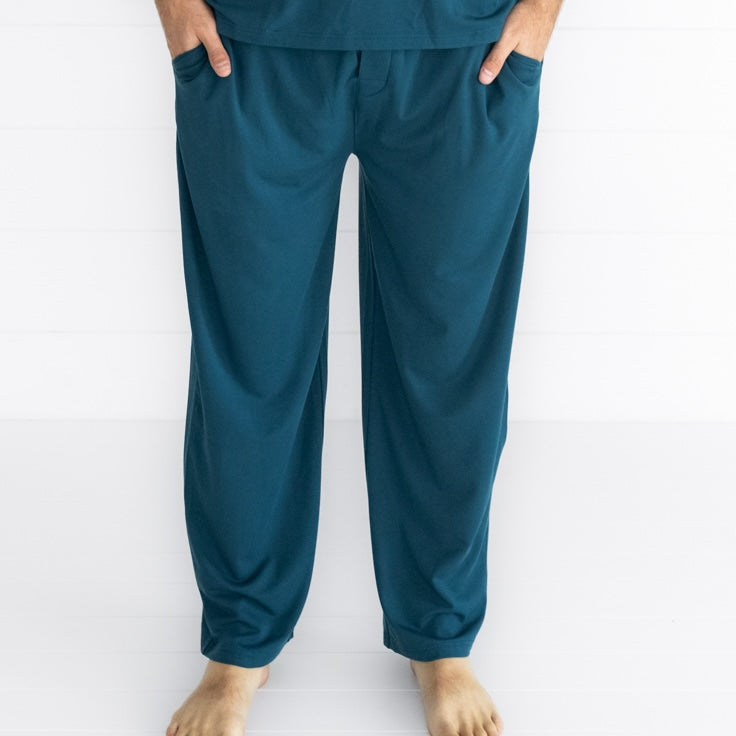 Close up image of a man wearing Cozy Twilight Teal pj pants