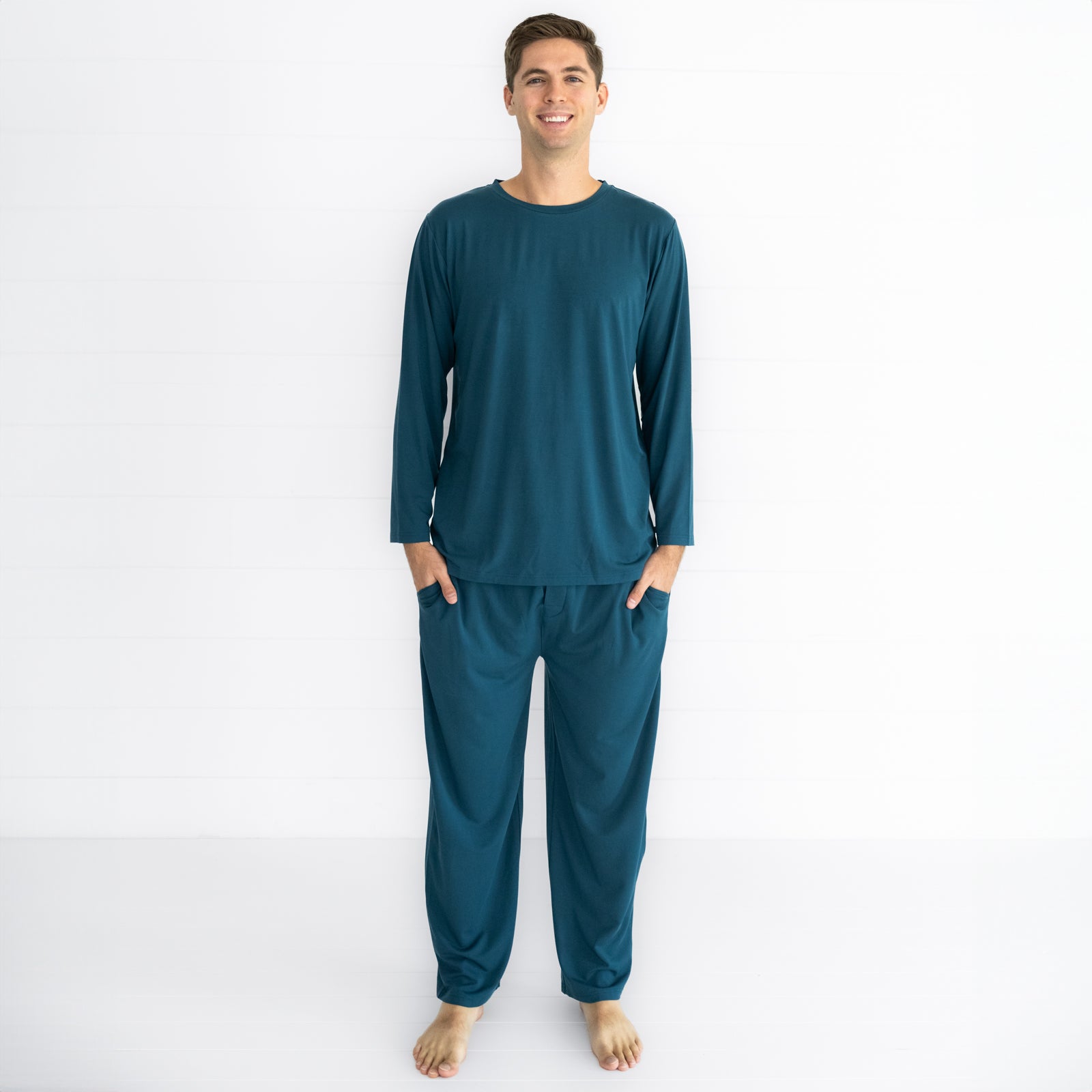 image of a man wearing a Cozy Twilight Teal men's pj top and matching pants