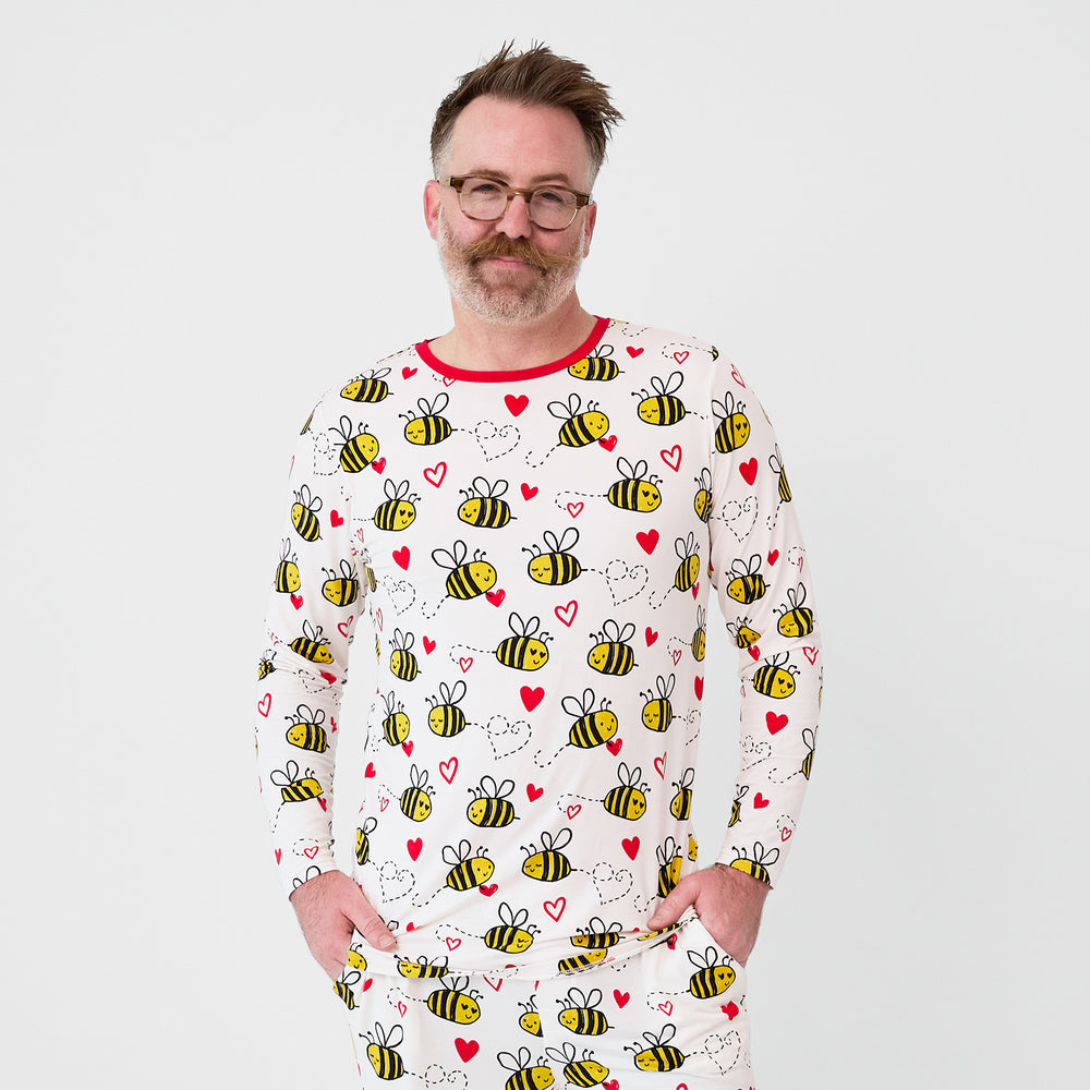 Close up image of a man wearing a Bee Mine printed men's pj top