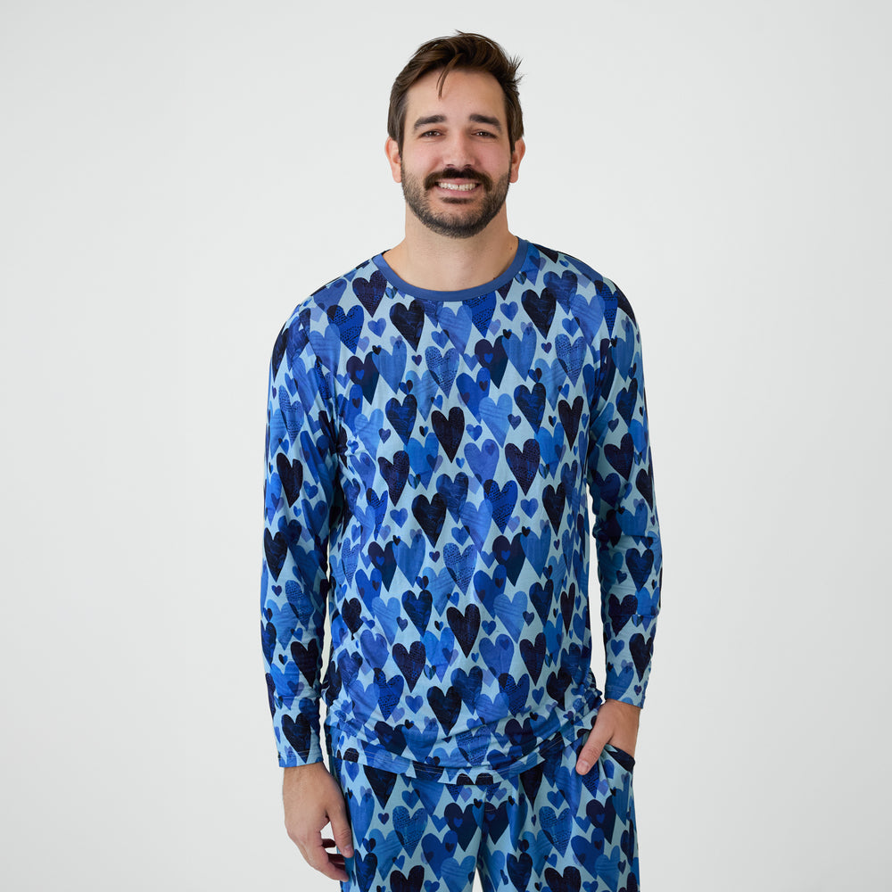 Man wearing Blue Hearts & Crafts pajamas.