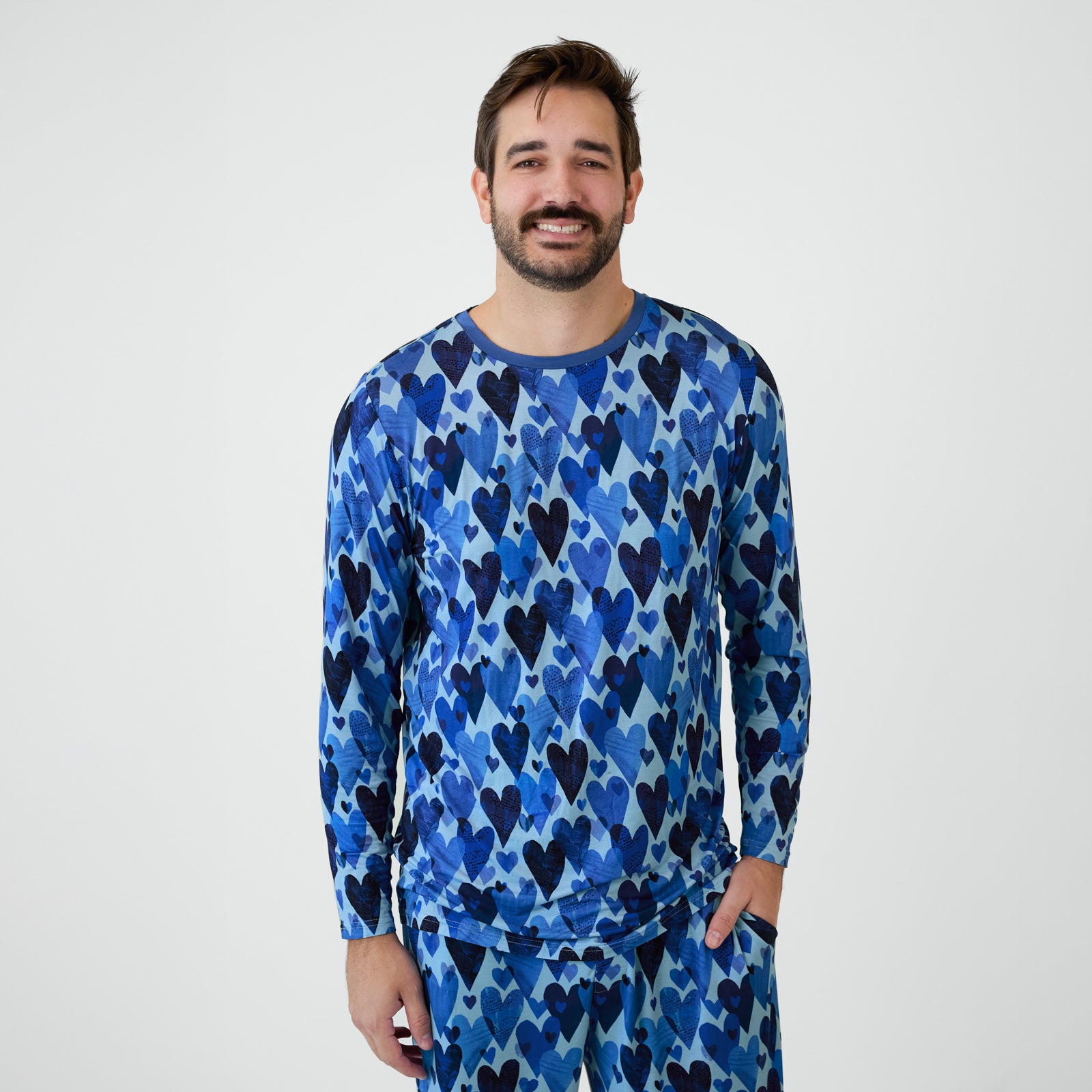 Man wearing Blue Hearts & Crafts pajamas.