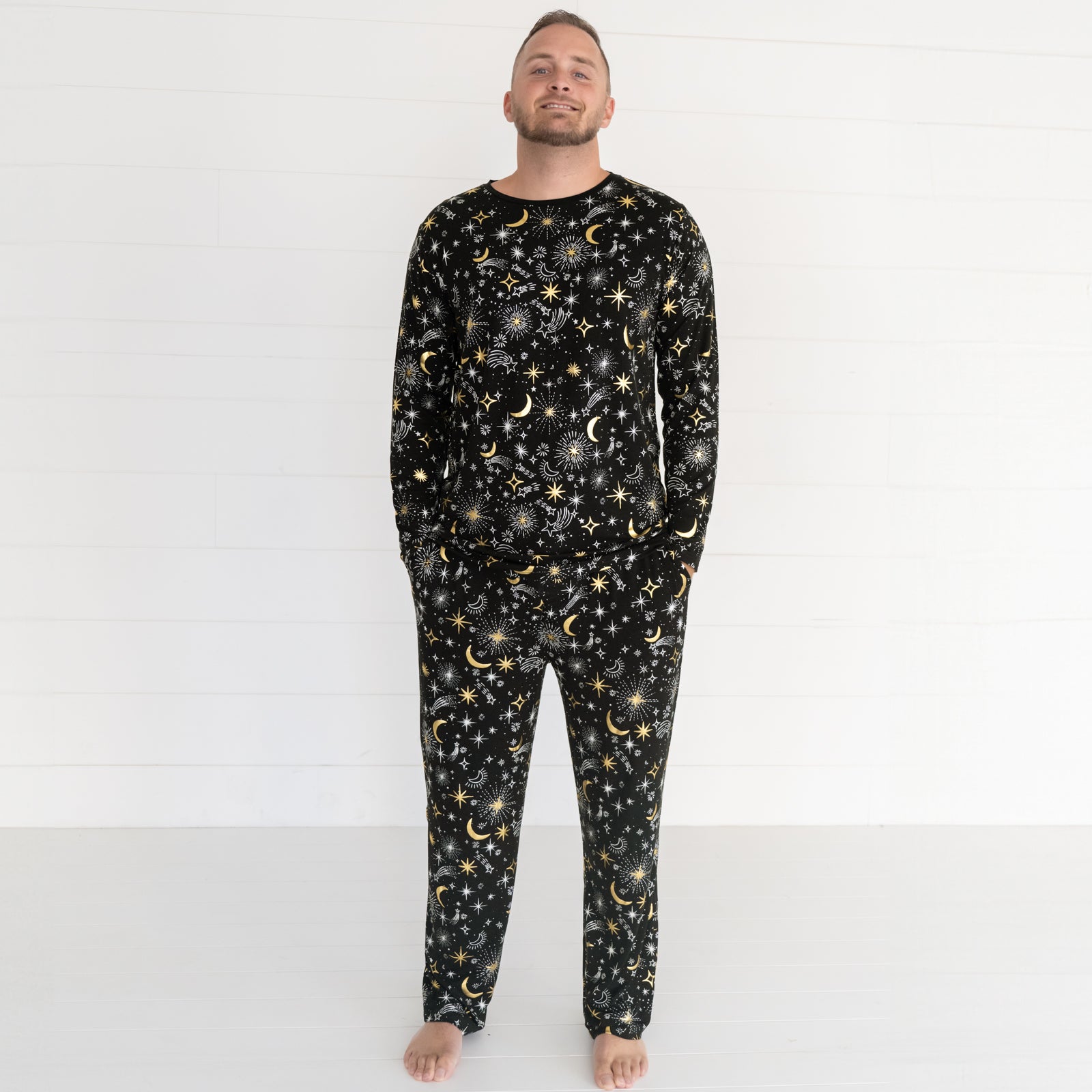  image of a man wearing Celebration Stars pj pants paired with a matching men's pj top