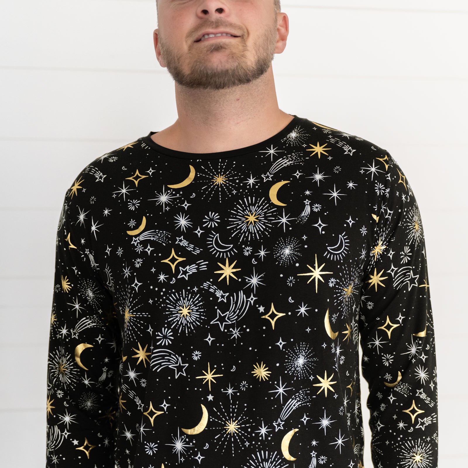 Close up image of a man wearing Celebration Stars men's pj top