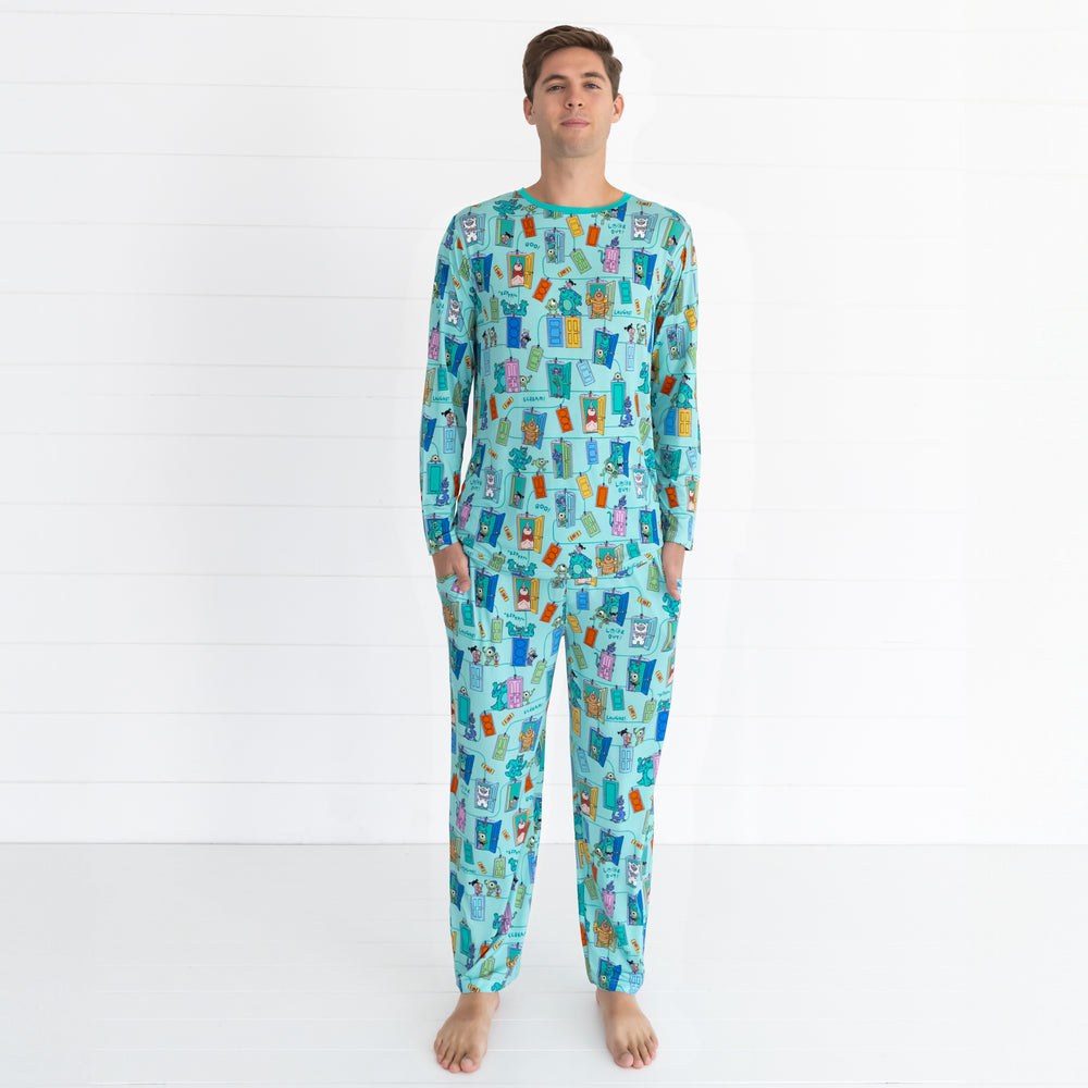 Male model wearing the Disney Monsters, Inc. Scream Team Men's Pajama Pants and Disney Monsters, Inc. Scream Team Men's Pajama Top