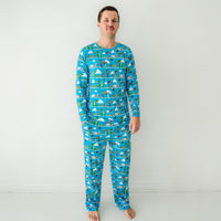 Man wearing a Disney Pixar Toy Story Pals men's pajama top and matching pajama pants