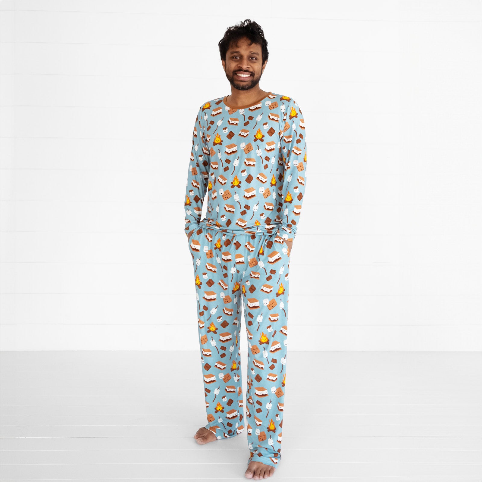 man wearing a men's S'mores Galore men's pj top and matching mens pj pants