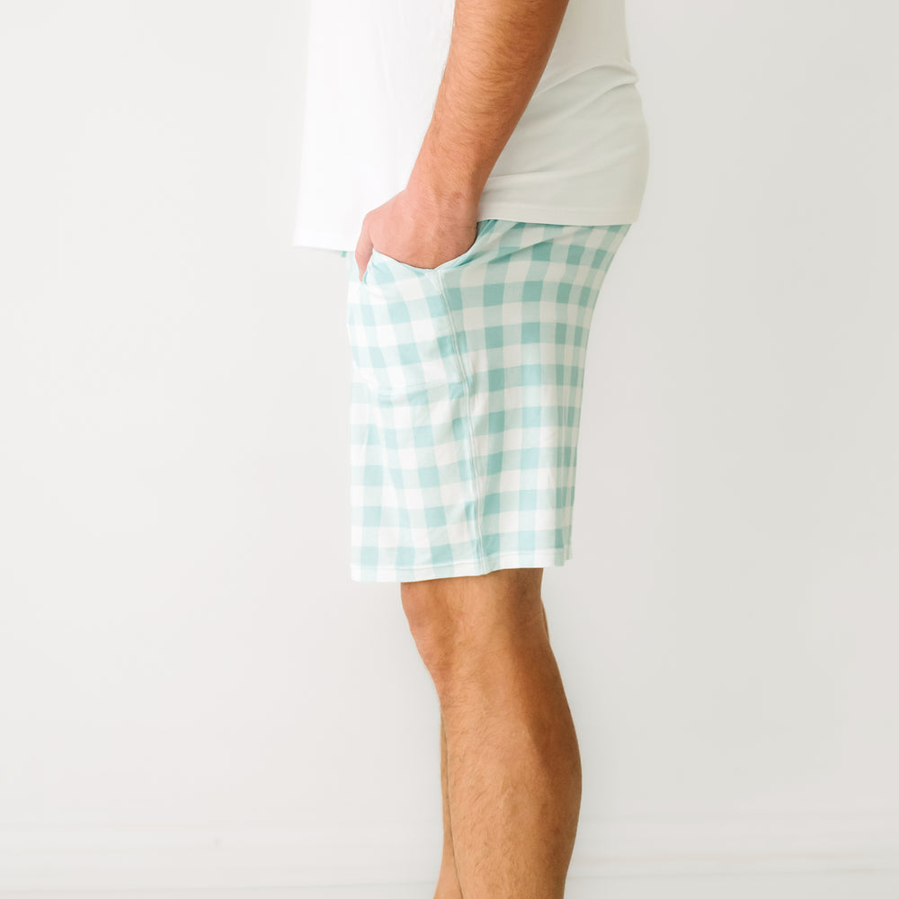 Click to see full screen - Close up profile image of a man wearing men's Aqua Gingham pajama shorts