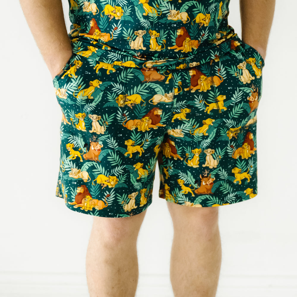 Close up image of a man wearing Disney Simba's Sky men's pajama shorts
