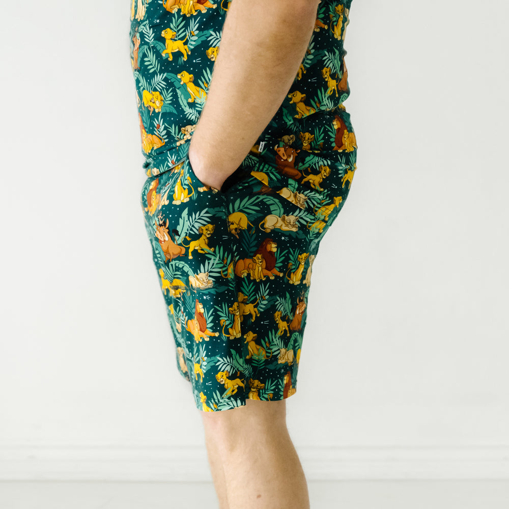 Close up profile image of a man wearing Disney Simba's Sky men's pajama shorts