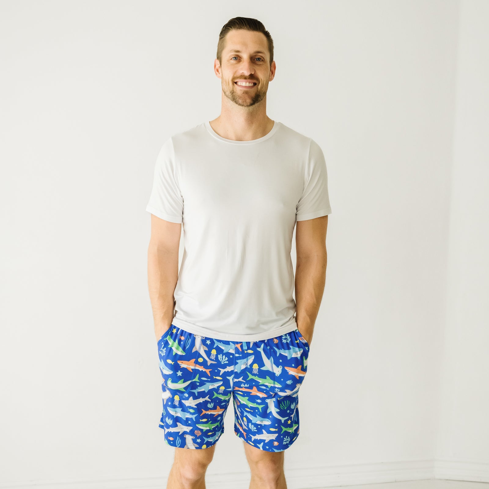 Man wearing Rad Reef men's pajama shorts and coordinating pajama top