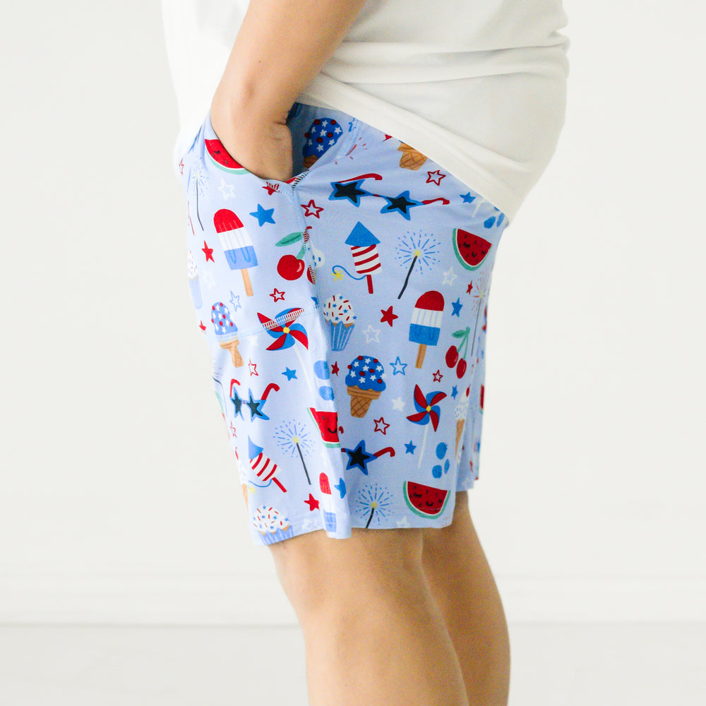 Profile close up image of a man wearing Stars Stripes and Sweets printed men's pj shorts