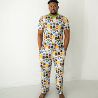 Man wearing a Legends of the Galaxy men's short sleeve pajama top and matching pajama pants