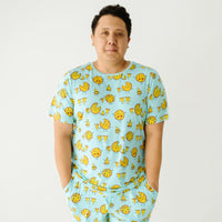 close up image of a man wearing a Pizza Pals men's pajama top