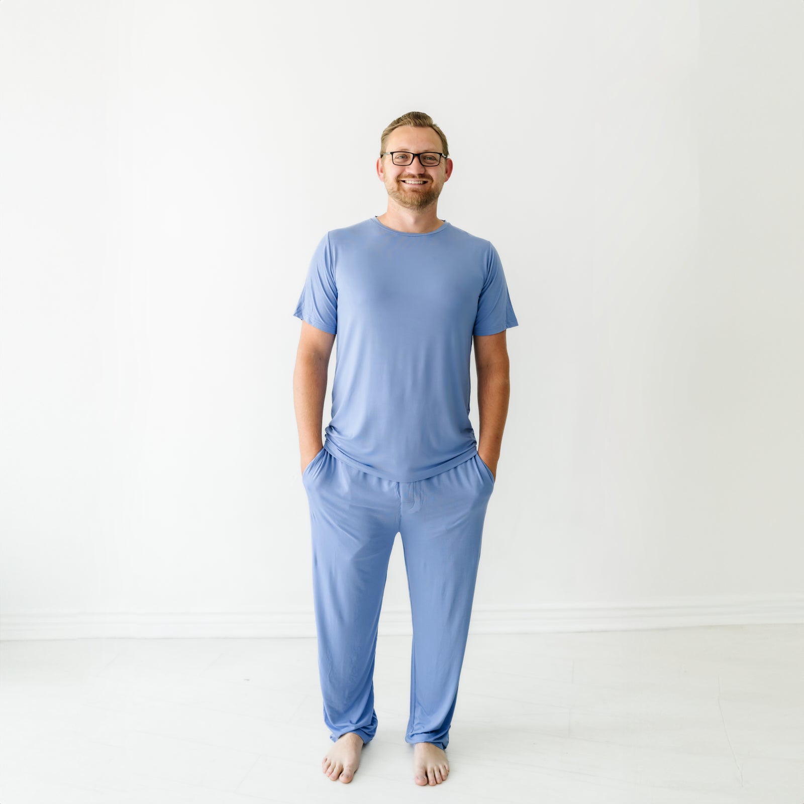 Image of a man wearing a Slate Blue men's short sleeve pajama top and matching men's pajama pants