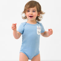 Child wearing a Lake Blue pocket bodysuit