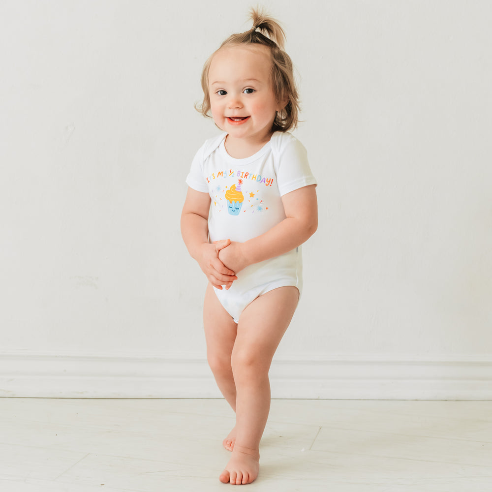 Image of a child wearing a It's my Half Birthday graphic bodysuit