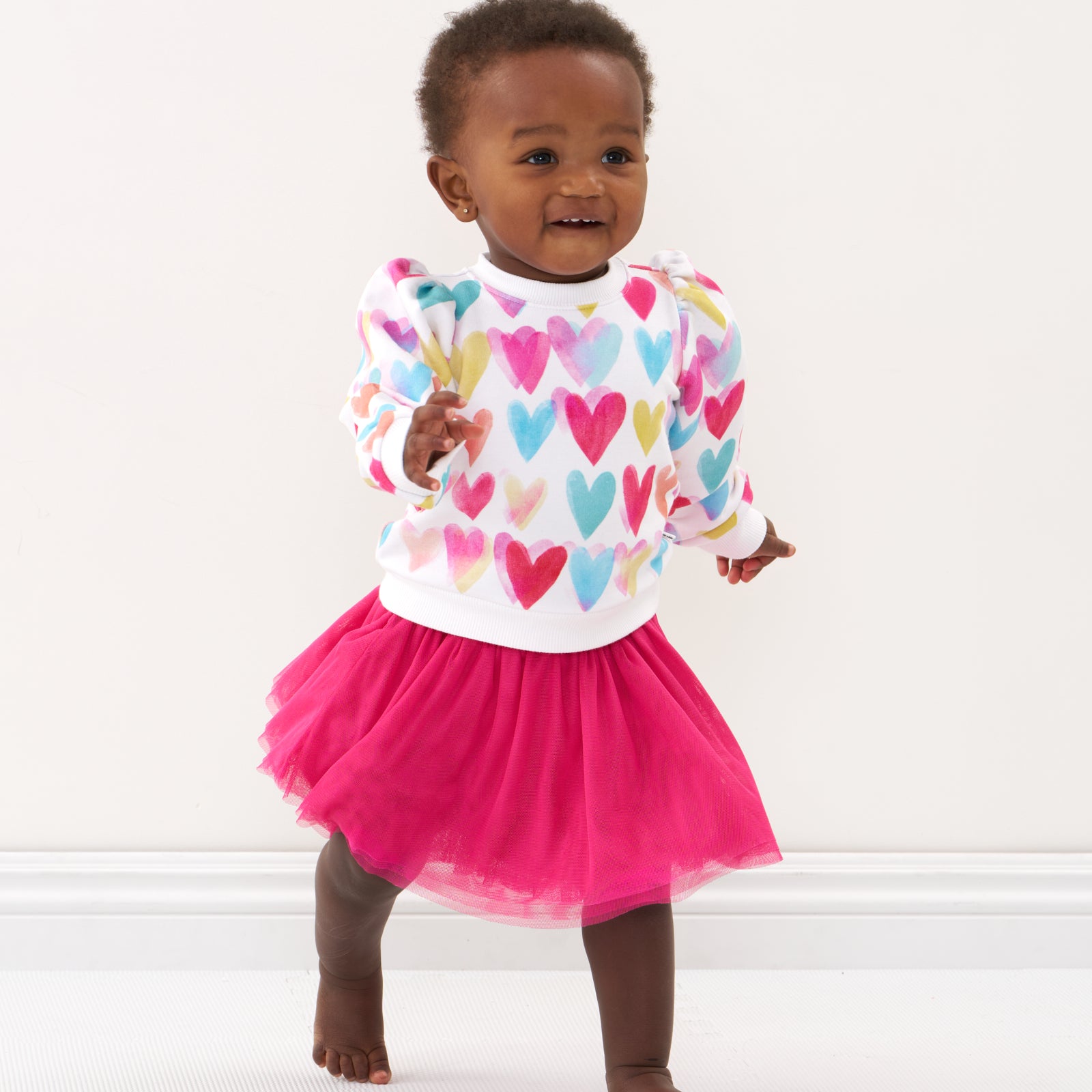 Baby in heart crewneck and tutu skirt