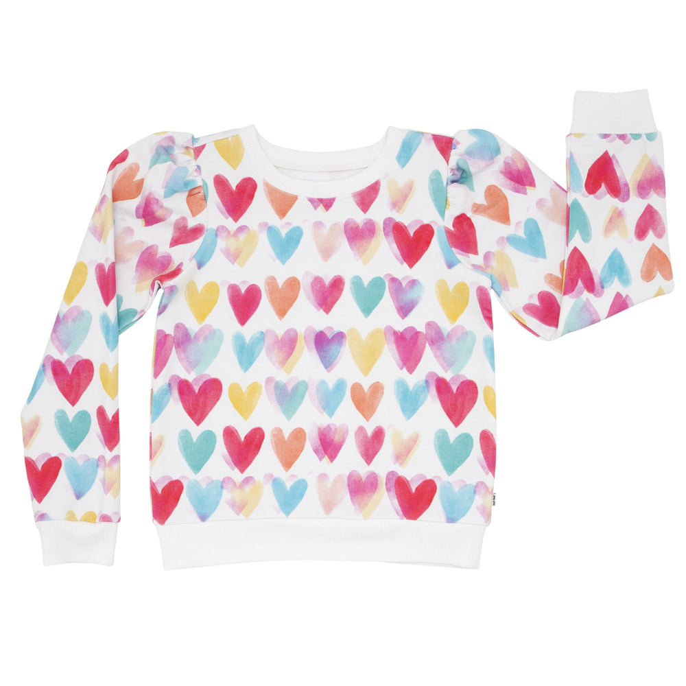 Click to see full screen - Flat lay image of a Watercolor Love puff sleeve crewneck
