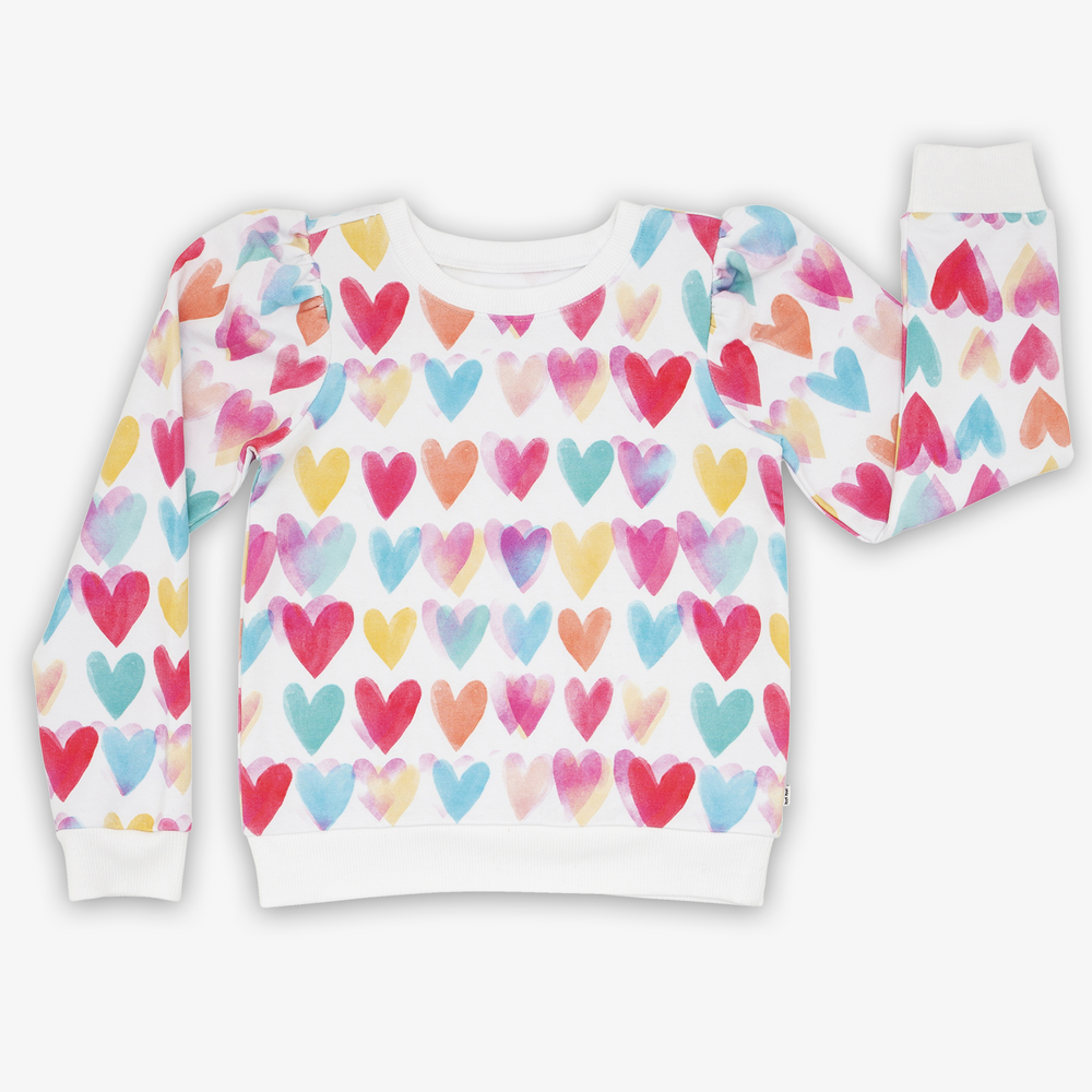 Flat lay image of the Watercolor Love Puff Sleeve Crewneck