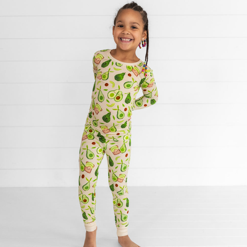 Alternate image of a child posing wearing an Avocado Toast two piece pj set