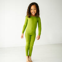 Child wearing an Avocado two piece pajama set
