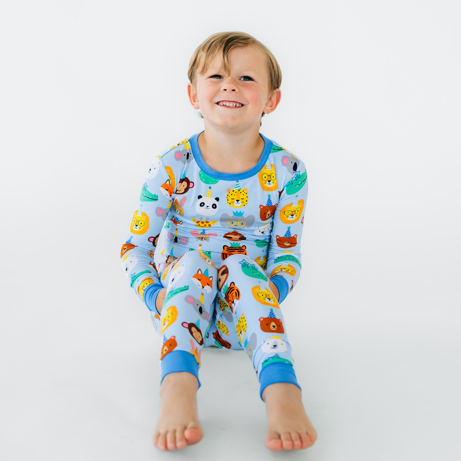 Alternate image of a child sitting wearing Blue Party Pals two piece pj set