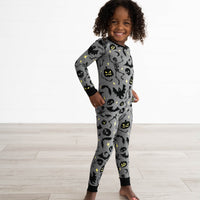 Girl posing in the Gray Glowing Ghouls Two-Piece Pajama Set