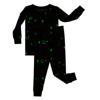 Flat lay image of the glow in the dark effect on aGray Glowing Ghouls Two-Piece Pajama Set