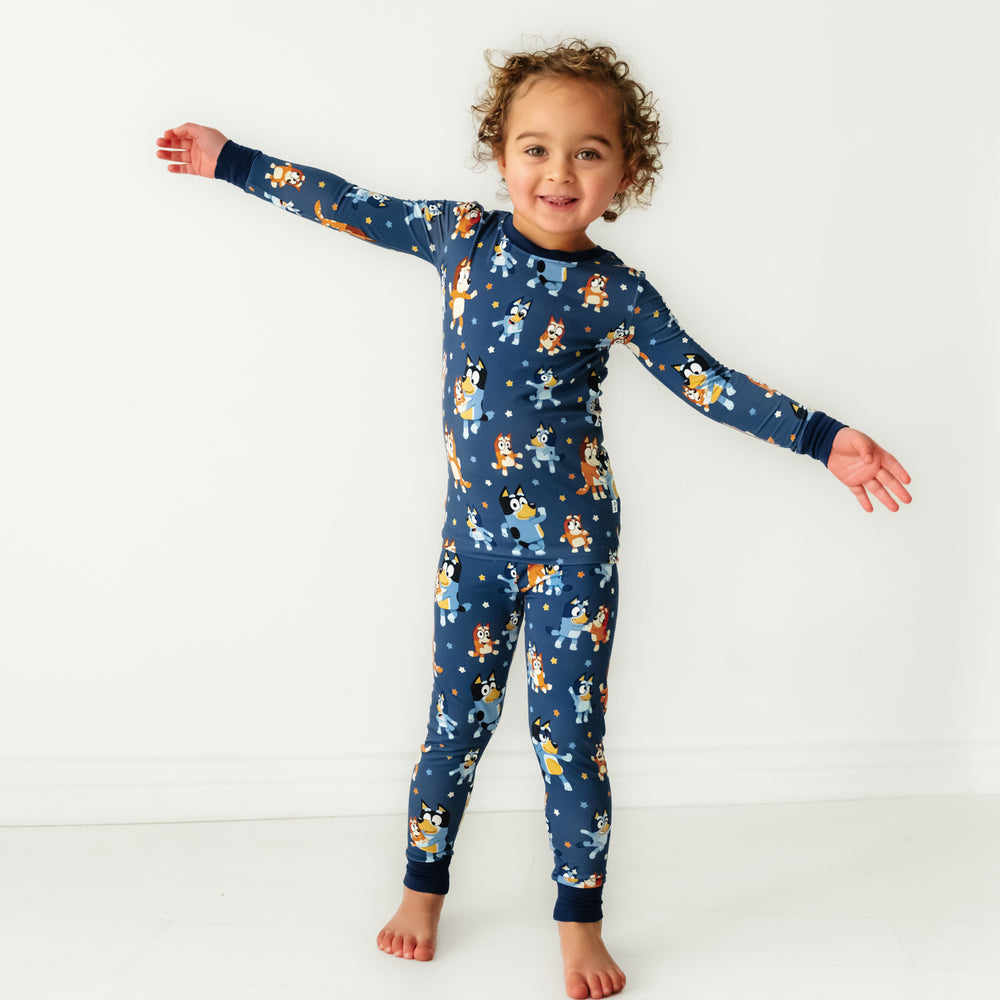 Child dancing wearing a Bluey Dance Mode two piece pajama set
