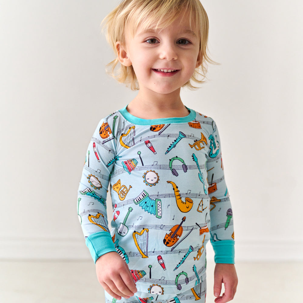 Close up image of a child wearing a Play Along two-piece pajama set