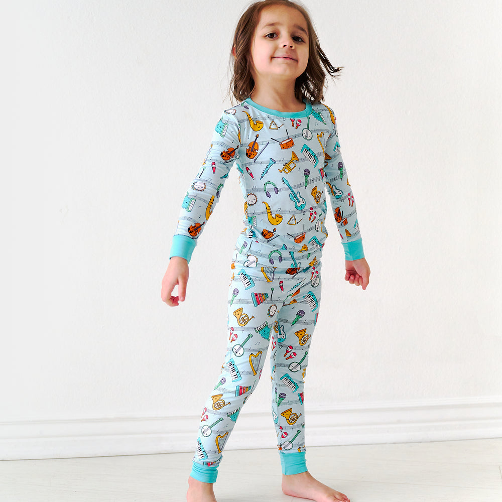 Child wearing a Play Along two-piece pajama set