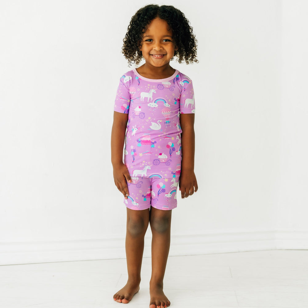 child wearing a Magical Birthday two piece shorts and short sleeve pj set