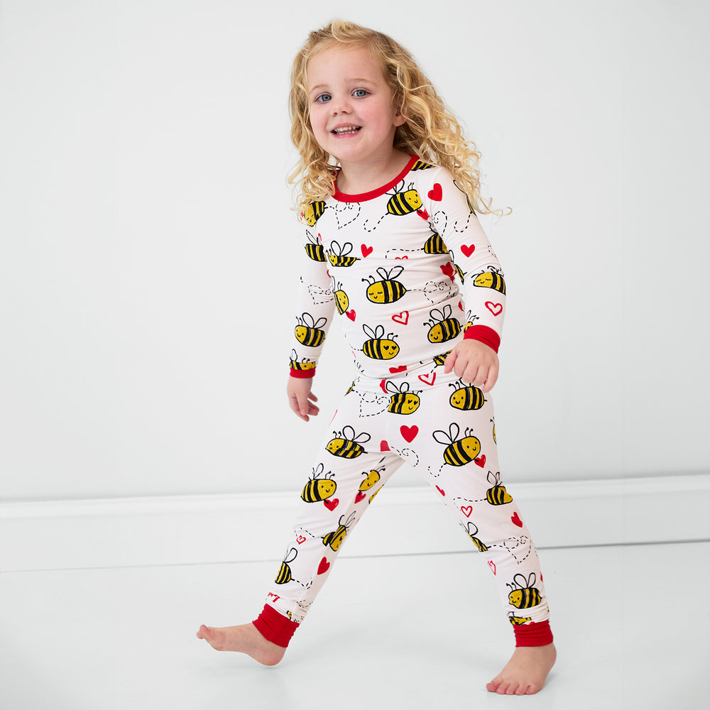 Image of a child wearing a Bee Mine two piece pj set