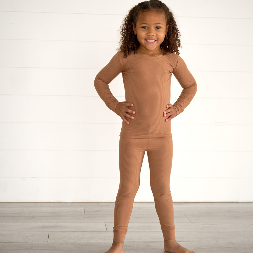 Girl posing while wearing the Caramel Ribbed Two-Piece Pajama Set