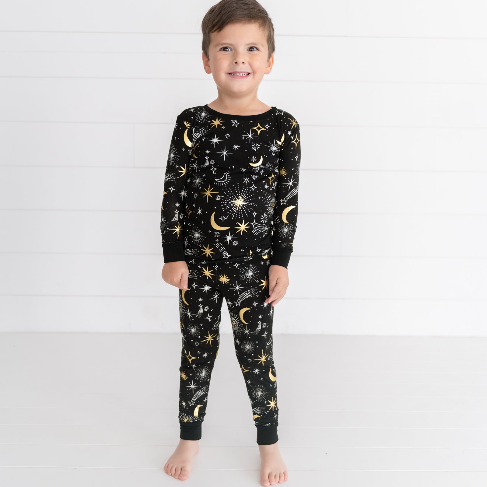 Alternate image of a child posing wearing a Celebration Stars two piece pj set