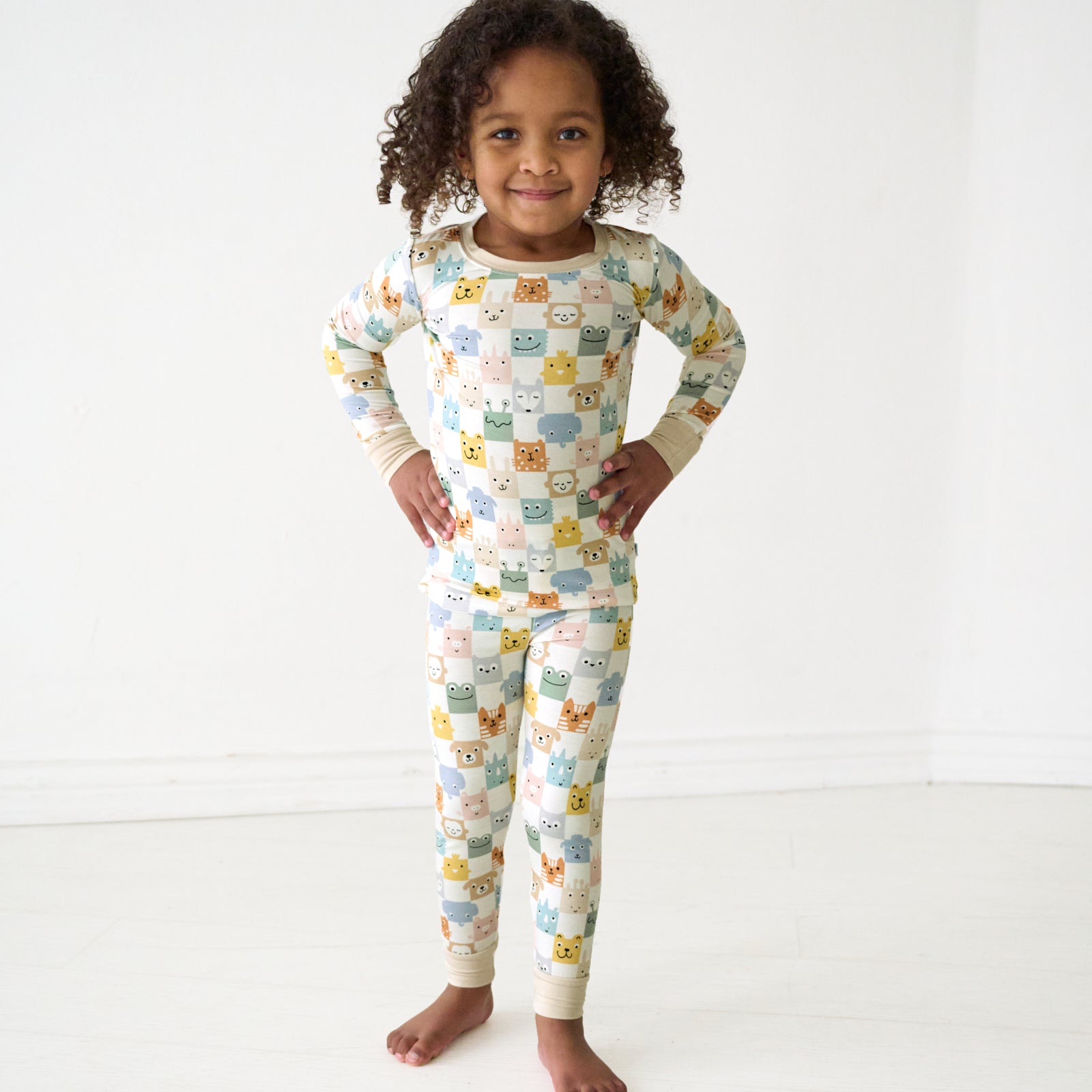 Child wearing a Check Mates two-piece pajama set