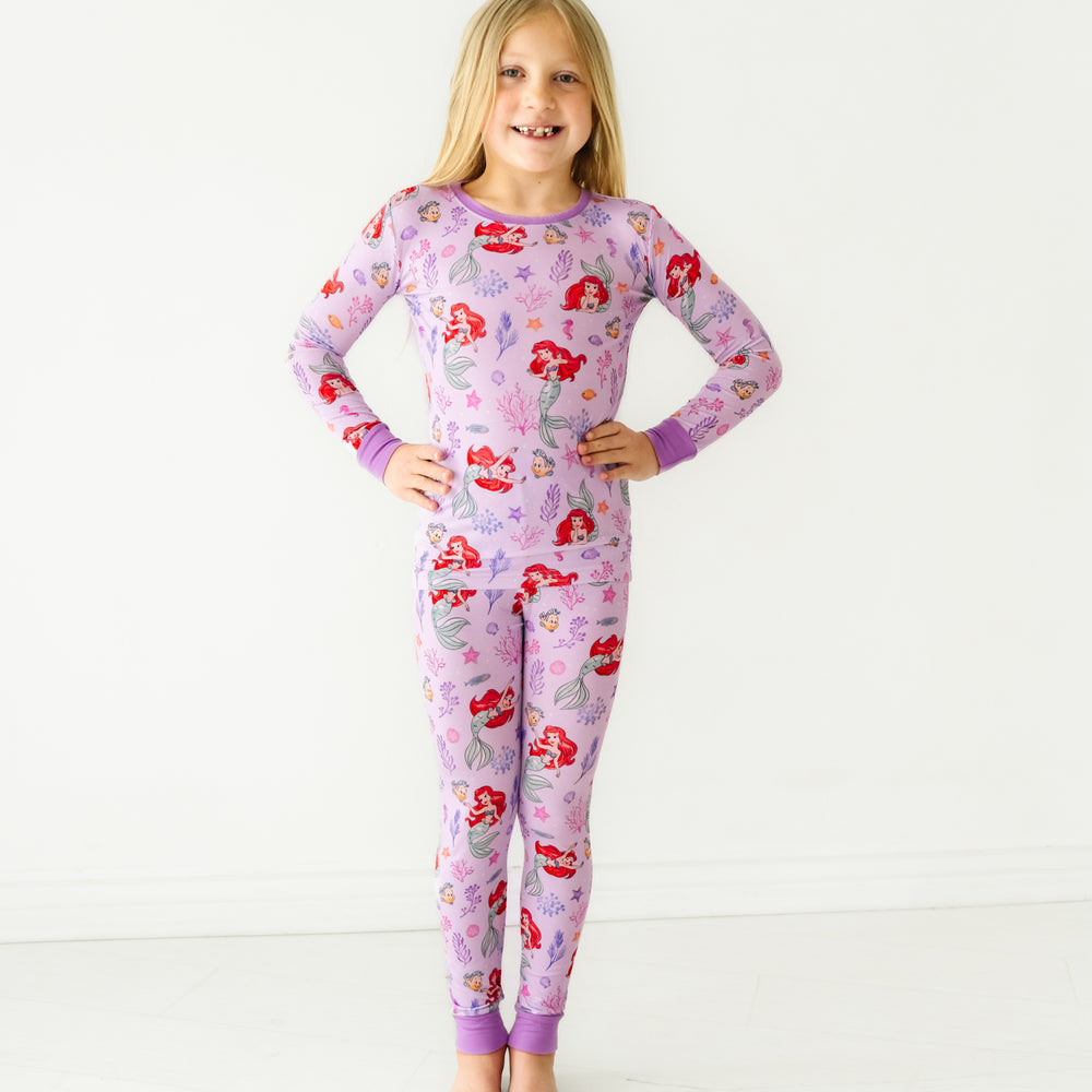 Alternate image of a child posing wearing a Disney Part of Her World two piece pajama set
