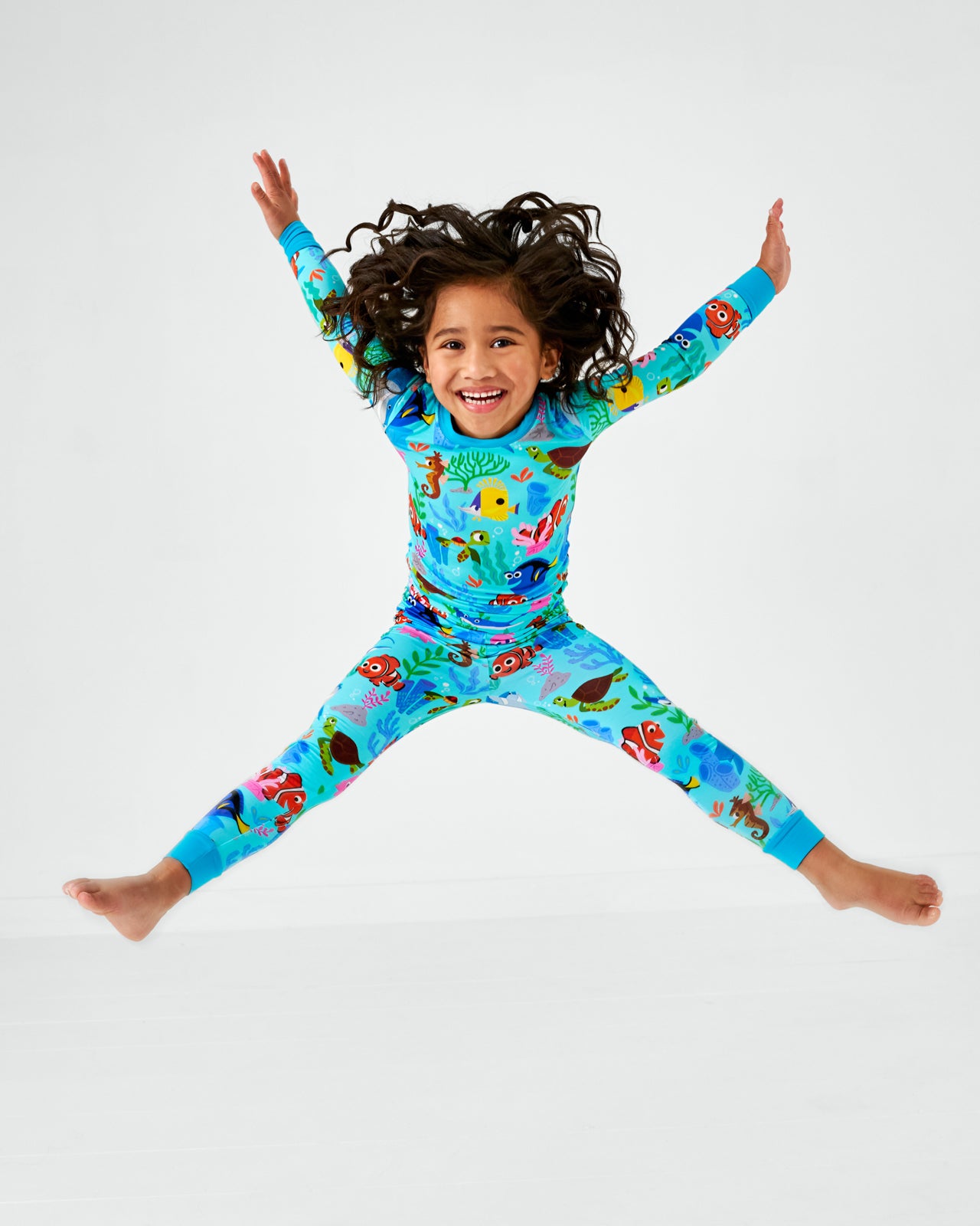 Jumping child wearing the Disney Nemo's Reef Two-Piece Pajama Set